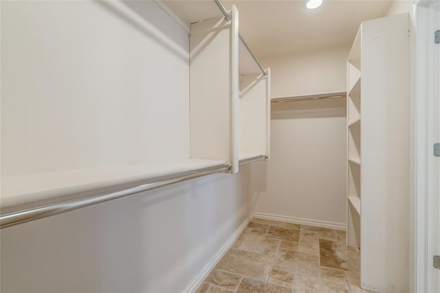 6704 Tall Oaks Dr, Oklahoma City, OK 73127 - spacious closet with light stone finish floors