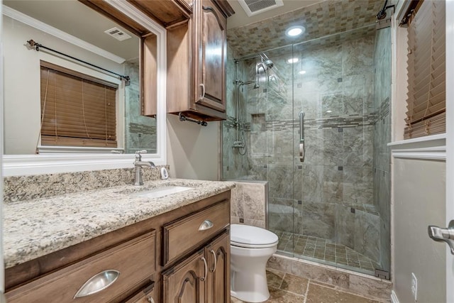 6704 Tall Oaks Dr, Oklahoma City, OK 73127 - full bath with vanity, a shower stall, stone finish floors, and crown molding
