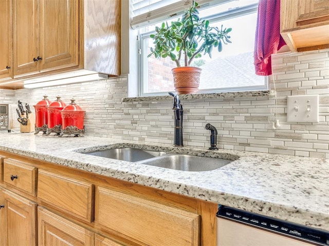 1405 Cambridge Ct, Shawnee, OK 74804 - kitchen featuring dishwashing machine, backsplash, and light stone counters