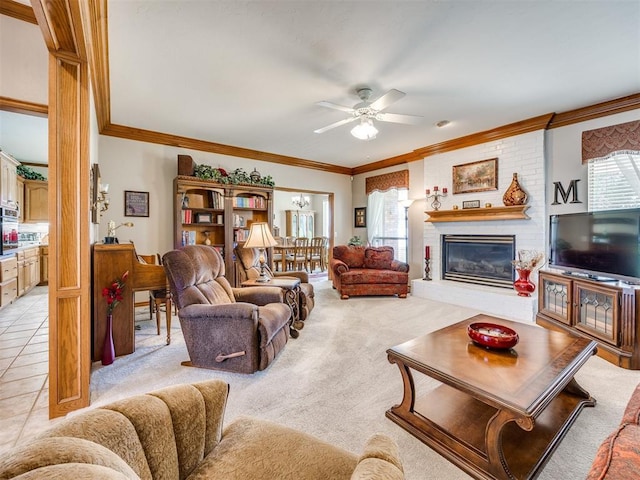 1405 Cambridge Ct, Shawnee, OK 74804 - living area featuring ceiling fan, ornamental molding, a brick fireplace, and light colored carpet