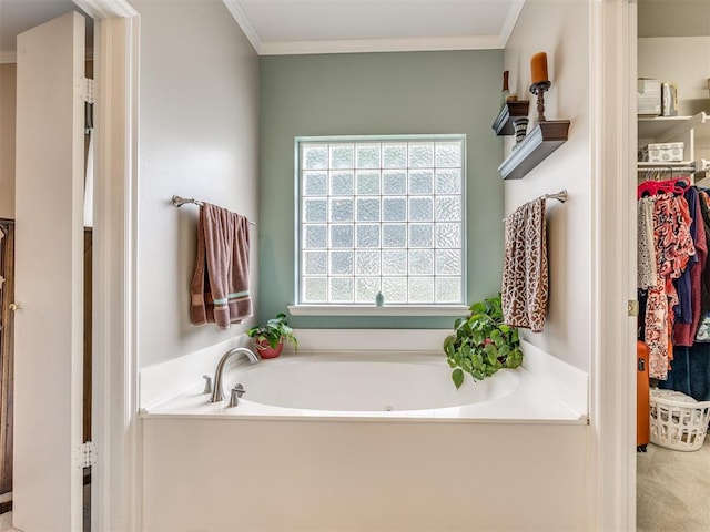 1405 Cambridge Ct, Shawnee, OK 74804 - bathroom with a bath, ornamental molding, and a spacious closet