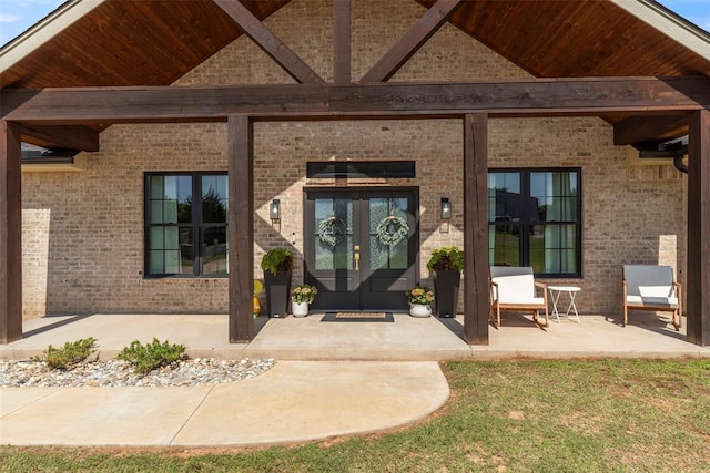 1074 Fawn Meadow Dr, Blanchard, OK 73010 - view of exterior entry with french doors and brick siding