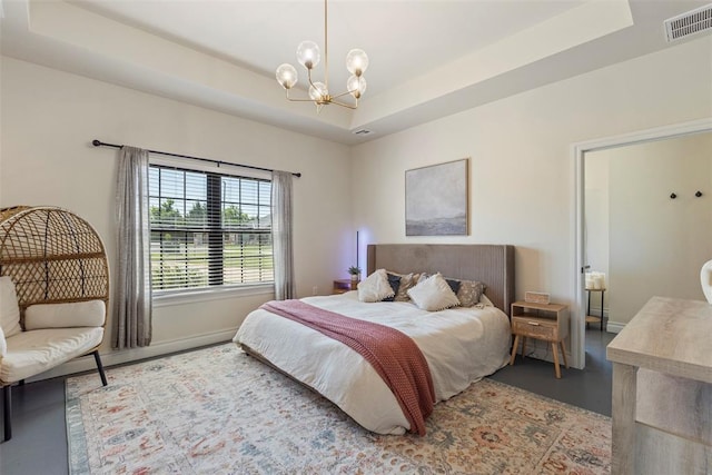 1074 Fawn Meadow Dr, Blanchard, OK 73010 - bedroom with a chandelier, finished concrete flooring, and a raised ceiling