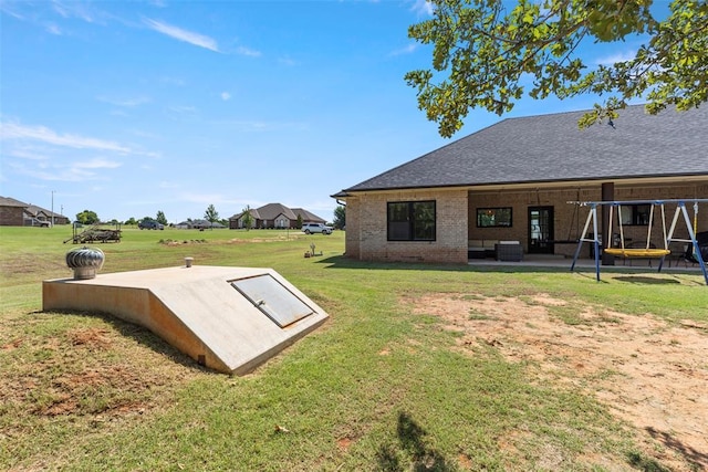 1074 Fawn Meadow Dr, Blanchard, OK 73010 - view of storm shelter featuring a yard