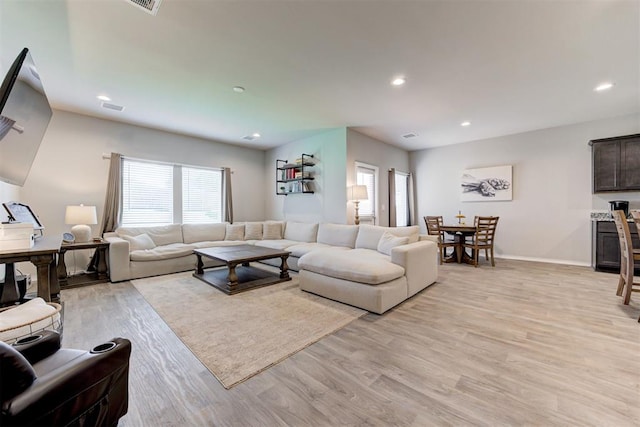 10409 NW 25th St, Yukon, OK 73099 - living area with plenty of natural light, light wood-style floors, and recessed lighting