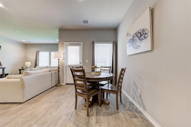 10409 NW 25th St, Yukon, OK 73099 - dining area with light wood-type flooring and baseboards