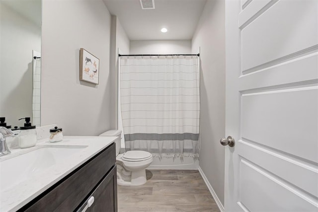 10409 NW 25th St, Yukon, OK 73099 - full bathroom featuring vanity and wood finished floors
