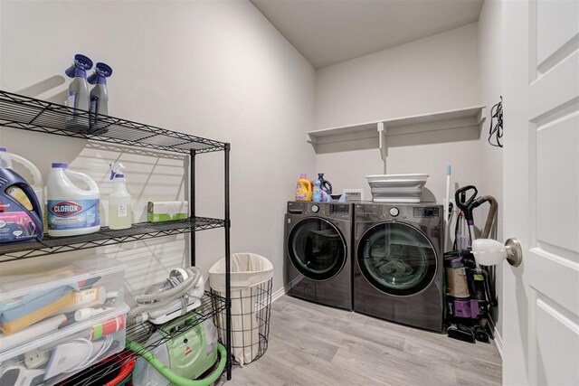 10409 NW 25th St, Yukon, OK 73099 - washroom featuring independent washer and dryer and wood finished floors