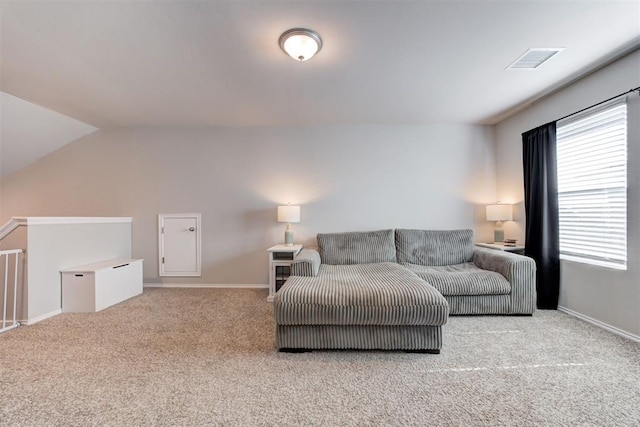 10409 NW 25th St, Yukon, OK 73099 - living area featuring carpet floors and lofted ceiling