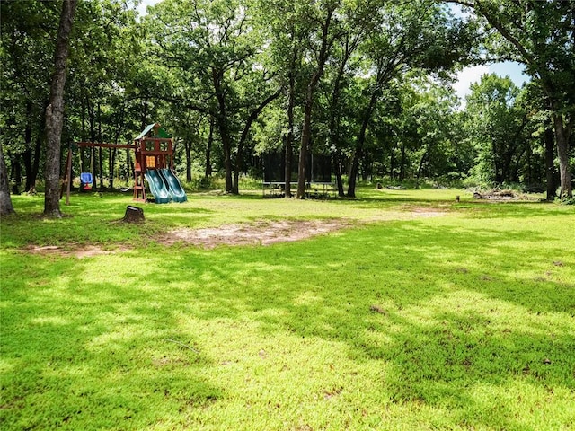 16940 Wildwood Dr, Lexington, OK 73051 - view of green lawn with a playground