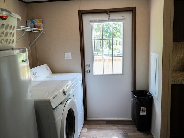 16940 Wildwood Dr, Lexington, OK 73051 - washroom featuring washer and dryer, water heater, and wood finished floors