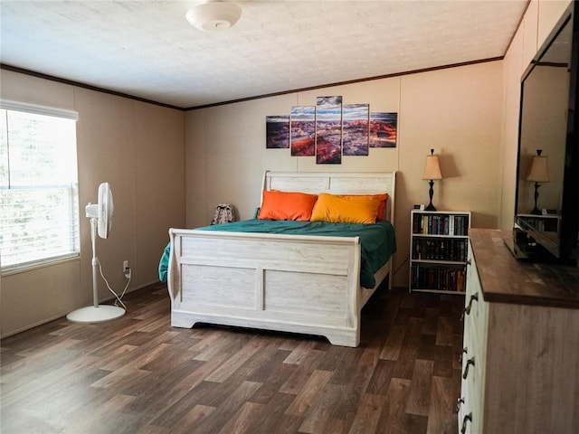 16940 Wildwood Dr, Lexington, OK 73051 - bedroom featuring dark wood finished floors, crown molding, and a textured ceiling