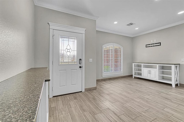 517 N Quail Run, Altus, OK 73521 - entryway featuring ornamental molding, light wood finished floors, and recessed lighting