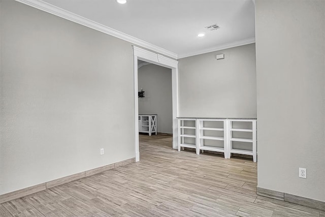 517 N Quail Run, Altus, OK 73521 - empty room featuring crown molding, wood finished floors, and recessed lighting