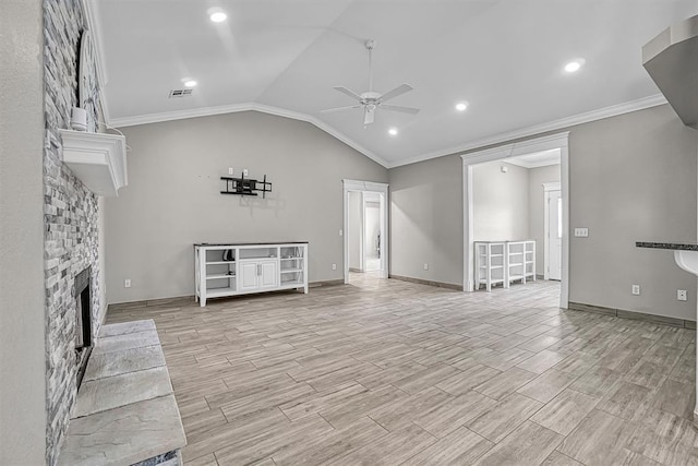 517 N Quail Run, Altus, OK 73521 - unfurnished living room with a ceiling fan, crown molding, a stone fireplace, light wood-style floors, and vaulted ceiling