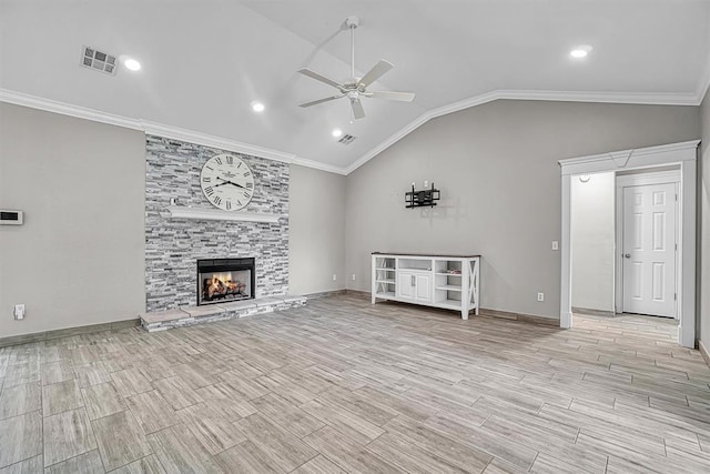 517 N Quail Run, Altus, OK 73521 - unfurnished living room with a ceiling fan, vaulted ceiling, wood finish floors, a stone fireplace, and crown molding