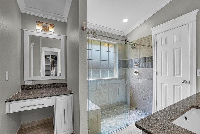 517 N Quail Run, Altus, OK 73521 - full bath featuring crown molding, vanity, tiled shower, and wood finished floors