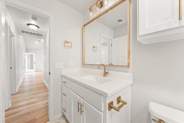 17717 Boling Farm Rd, Edmond, OK 73012 - half bath featuring vanity and wood finished floors