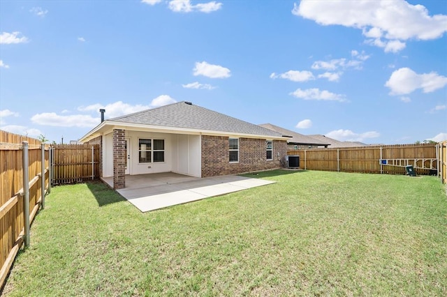 17717 Boling Farm Rd, Edmond, OK 73012 - back of house with brick siding, a fenced backyard, a patio, and roof with shingles