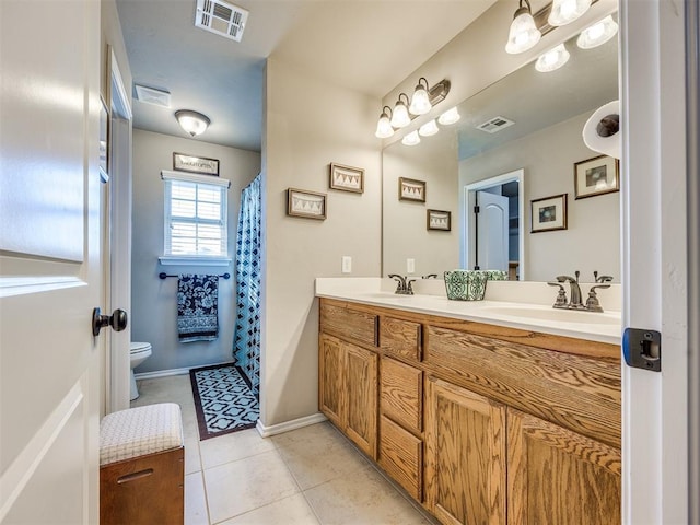 18204 Summer Grove Ave, Edmond, OK 73012 - bathroom with double vanity, tile patterned flooring, and curtained shower