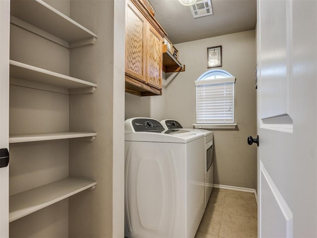 18204 Summer Grove Ave, Edmond, OK 73012 - laundry room with independent washer and dryer and cabinet space