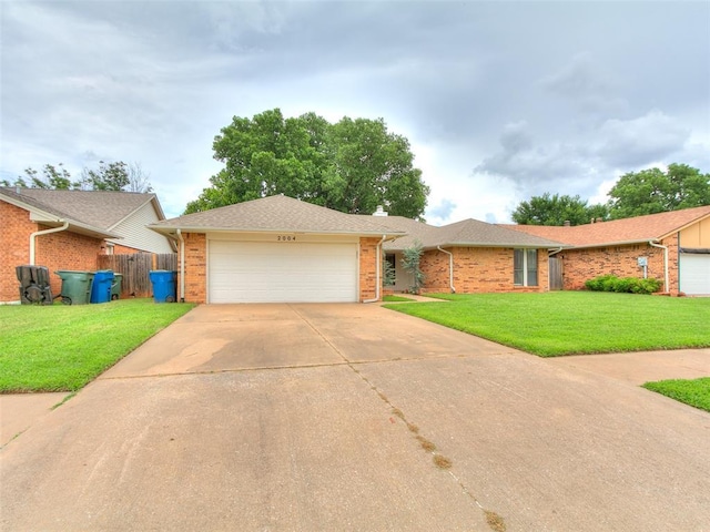 2004 Tanglewood Dr, Edmond, OK 73013 - ranch-style home featuring brick siding, concrete driveway, and an attached garage