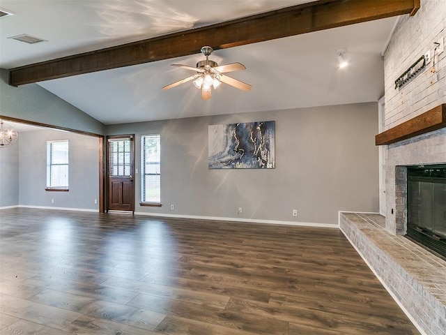 2004 Tanglewood Dr, Edmond, OK 73013 - unfurnished living room featuring a brick fireplace, wood finished floors, and a ceiling fan