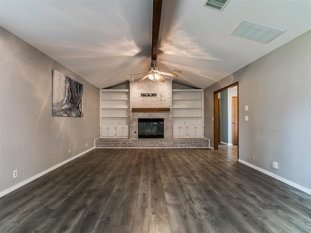 2004 Tanglewood Dr, Edmond, OK 73013 - unfurnished living room with dark wood finished floors, a ceiling fan, built in shelves, and a fireplace