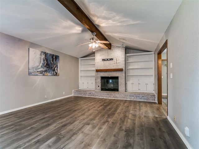 2004 Tanglewood Dr, Edmond, OK 73013 - unfurnished living room featuring wood finished floors, a ceiling fan, built in features, and a brick fireplace