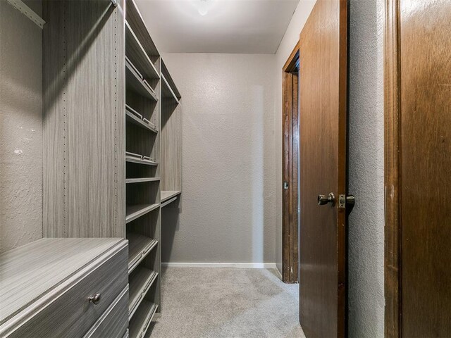 2004 Tanglewood Dr, Edmond, OK 73013 - spacious closet featuring carpet
