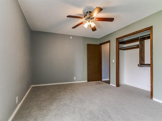 2004 Tanglewood Dr, Edmond, OK 73013 - unfurnished bedroom with carpet flooring, a textured ceiling, a ceiling fan, and a closet