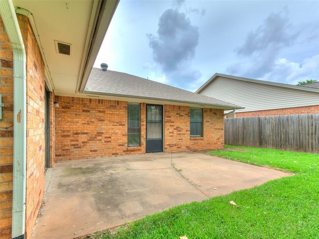 2004 Tanglewood Dr, Edmond, OK 73013 - fenced backyard with a patio area