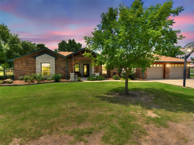 1616 E Cottonwood Rd, Goldsby, OK 73093 - view of front facade with a yard, an attached garage, and concrete driveway