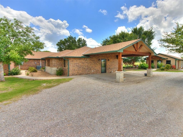 1616 E Cottonwood Rd, Goldsby, OK 73093 - view of front of house with brick siding and a shingled roof
