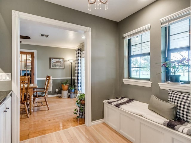 1616 E Cottonwood Rd, Goldsby, OK 73093 - sitting room featuring light wood finished floors and a chandelier