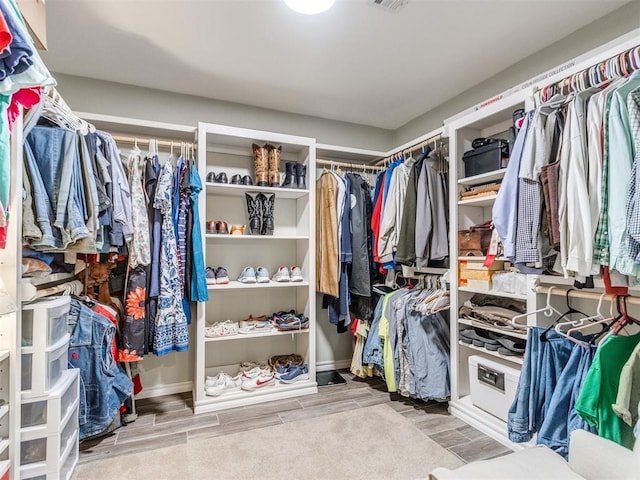 1616 E Cottonwood Rd, Goldsby, OK 73093 - spacious closet featuring wood finish floors