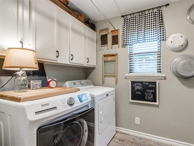 1616 E Cottonwood Rd, Goldsby, OK 73093 - laundry room with washing machine and dryer, cabinet space, and light wood-type flooring
