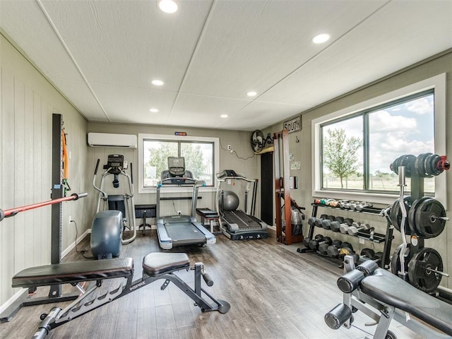 1616 E Cottonwood Rd, Goldsby, OK 73093 - workout area with an AC wall unit, wood finished floors, and recessed lighting