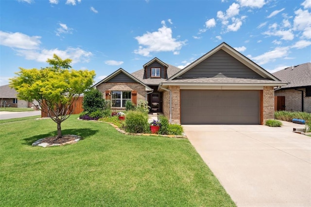 9233 NW 91st St, Yukon, OK 73099 - view of front of house with brick siding, a garage, driveway, and a front yard
