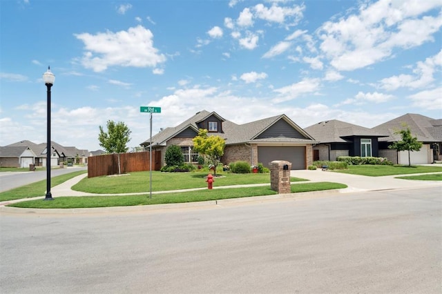 9233 NW 91st St, Yukon, OK 73099 - view of front of property with an attached garage, driveway, and brick siding