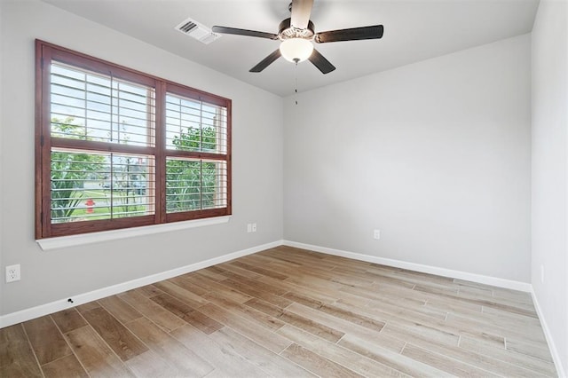 9233 NW 91st St, Yukon, OK 73099 - unfurnished room featuring light wood-type flooring and ceiling fan