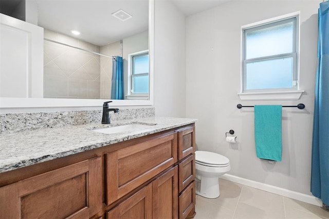 9233 NW 91st St, Yukon, OK 73099 - bathroom with vanity, tile patterned flooring, healthy amount of natural light, and a tile shower
