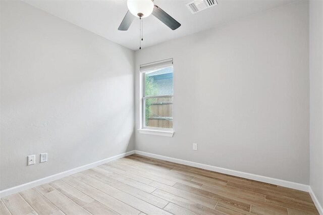 9233 NW 91st St, Yukon, OK 73099 - spare room featuring light wood finished floors and ceiling fan