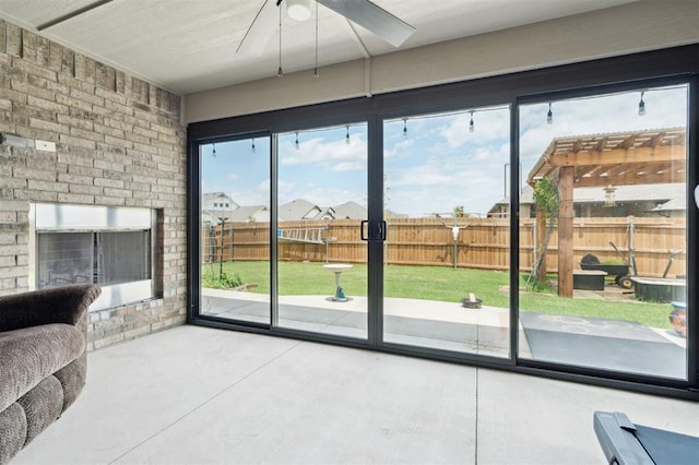 9233 NW 91st St, Yukon, OK 73099 - doorway to outside with ceiling fan and concrete floors