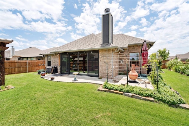 9233 NW 91st St, Yukon, OK 73099 - rear view of property with a patio, brick siding, a fenced backyard, and a shingled roof