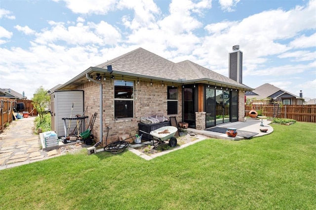 9233 NW 91st St, Yukon, OK 73099 - rear view of property featuring a patio area, a fenced backyard, a shingled roof, and a chimney