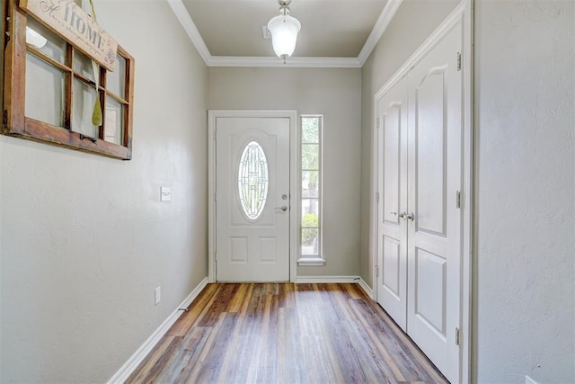 2209 Cedar Pointe Ct, Edmond, OK 73003 - entrance foyer with wood finished floors and ornamental molding