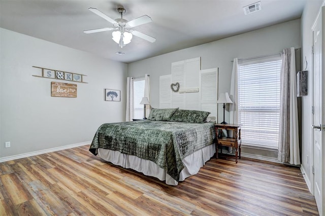 2209 Cedar Pointe Ct, Edmond, OK 73003 - bedroom with wood finished floors and ceiling fan