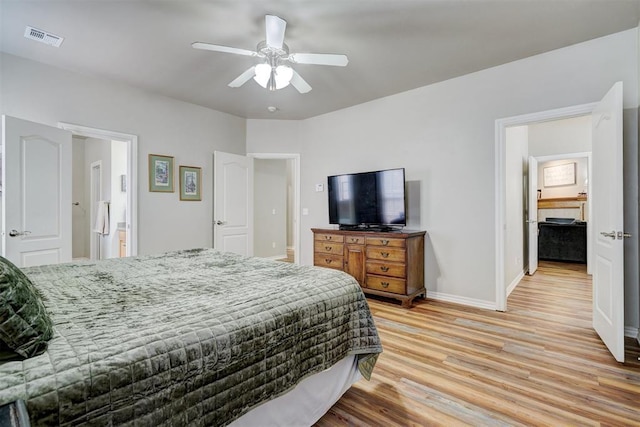 2209 Cedar Pointe Ct, Edmond, OK 73003 - bedroom with light wood-style floors and a ceiling fan