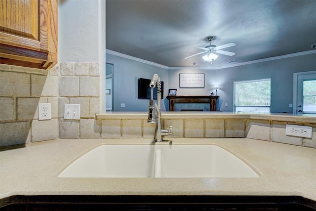 2209 Cedar Pointe Ct, Edmond, OK 73003 - kitchen featuring a ceiling fan, ornamental molding, open floor plan, and a fireplace